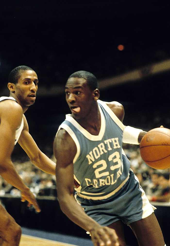 North Carolina Tar Heels guard Michael Jordan (23) in action against Duke Blue Devils guard Tommy Amaker (4) during the ACC tournament at Greensboro Coliseum. Duke defeated North Carolina 77-75.